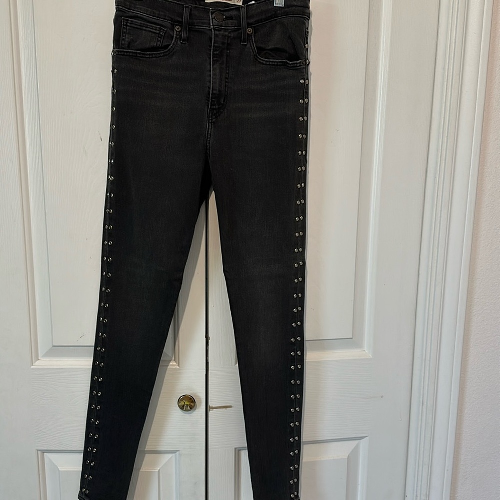 Black skinny jeans with studs